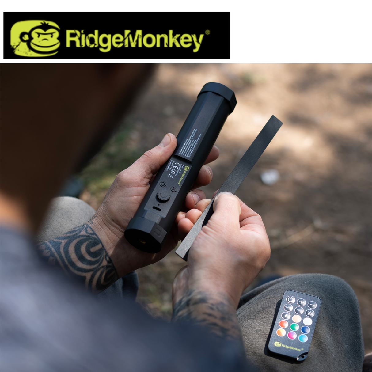 RidgeMonkey Base Lite IR camping light emitting warm infrared glow, compact and portable for outdoor adventures.