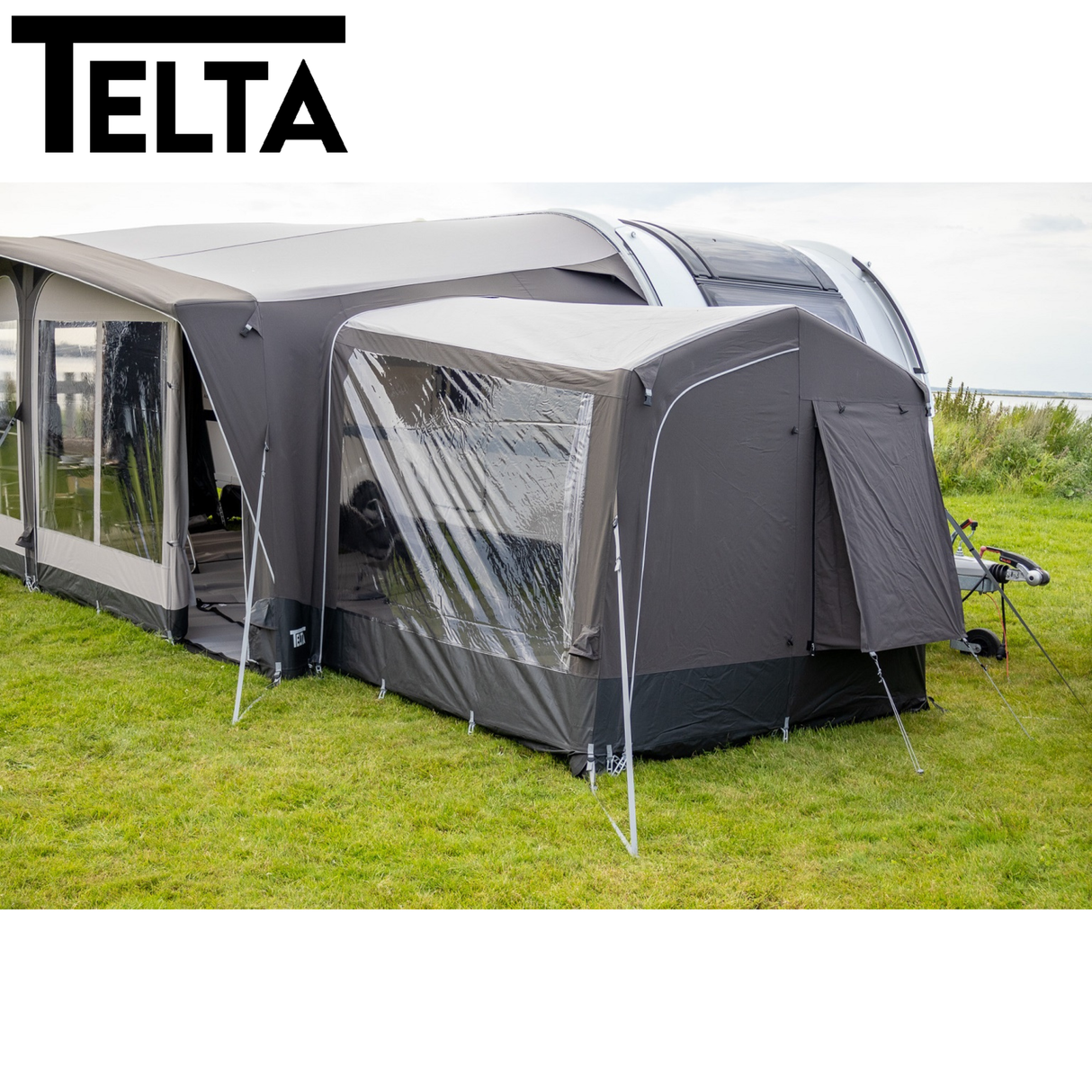 Telta Touring Extra Tall Annexe air awning, showcasing spacious design and vibrant fabric in outdoor setting.