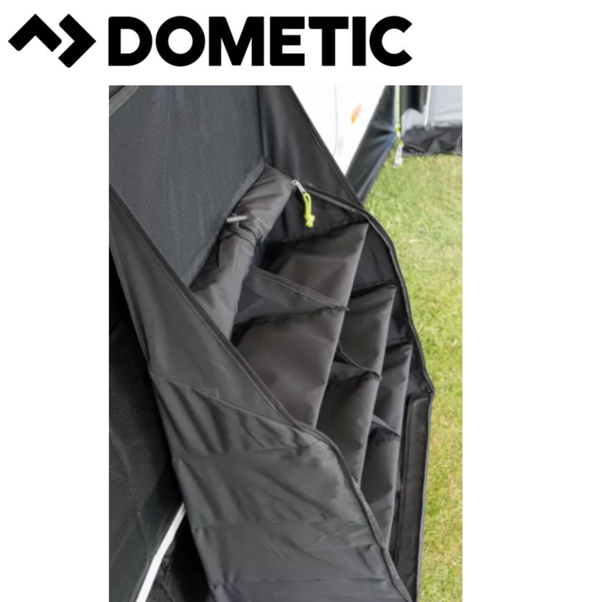 Dometic AccessoryTrack Pro Awning Organiser mounted on an RV, with multiple straps and pockets for storing awning accessories.