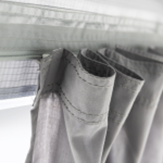 Dometic Grande Air Tour 390 air awning displayed with its fabric and structure in a camping setting.