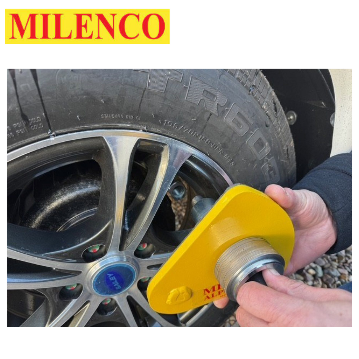 Milenco Alpha Gold Wheel Lock secured on a wheel, showcasing its durable design and bright gold color.
