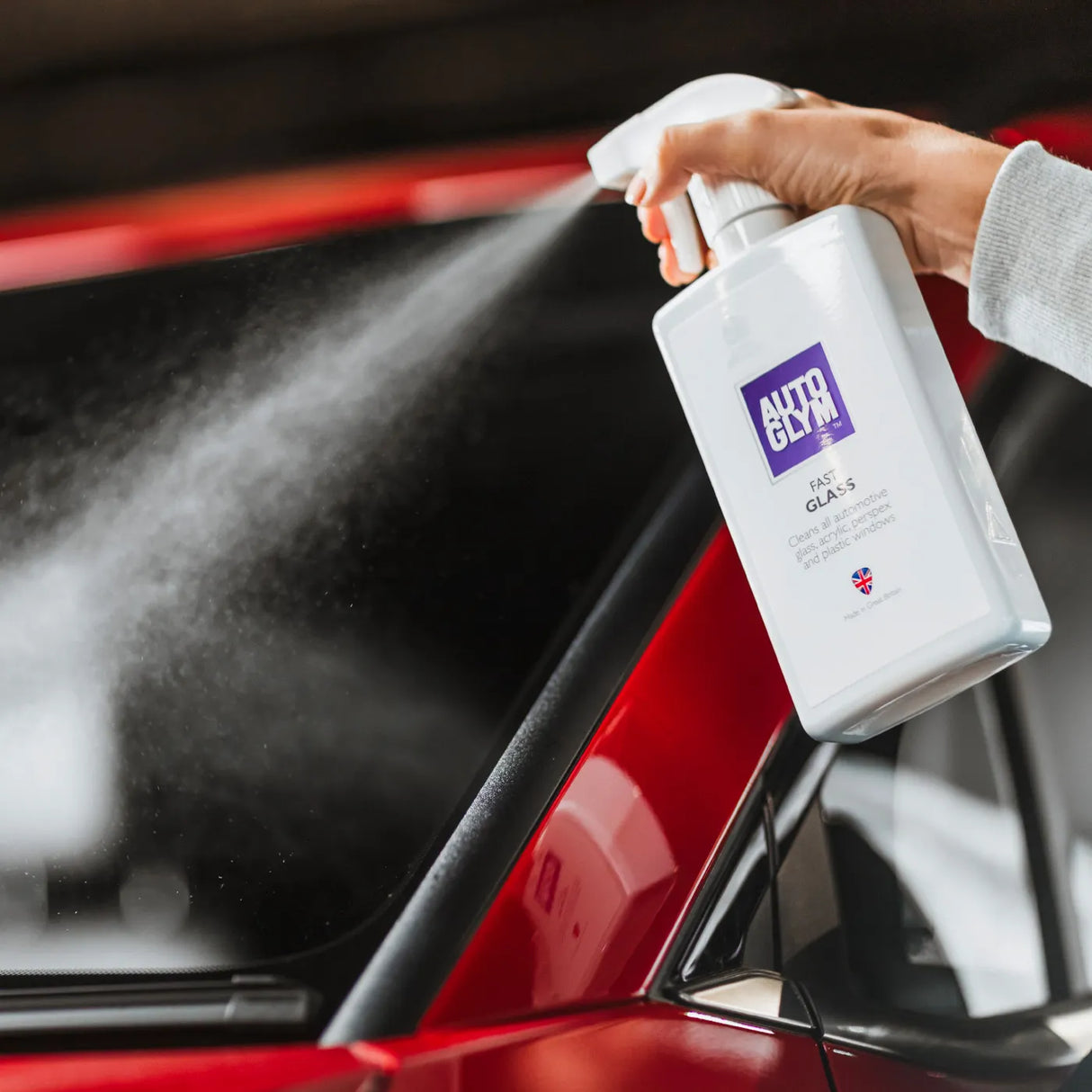 Autoglym Fast Glass vehicle cleaner bottle with spray nozzle on a clear background.