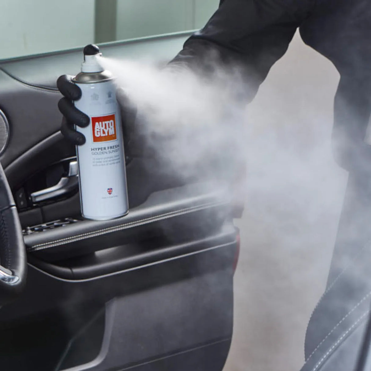 Autoglym Hyper Fresh Golden Sunset vehicle cleaner in a sleek bottle with a vibrant sunset design.