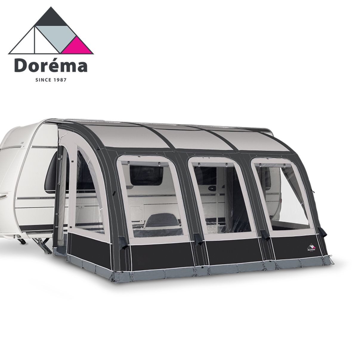 Dorema Magnum Air Force 390 all season air awning set up outside a caravan, showcasing its spacious design and durable fabric.