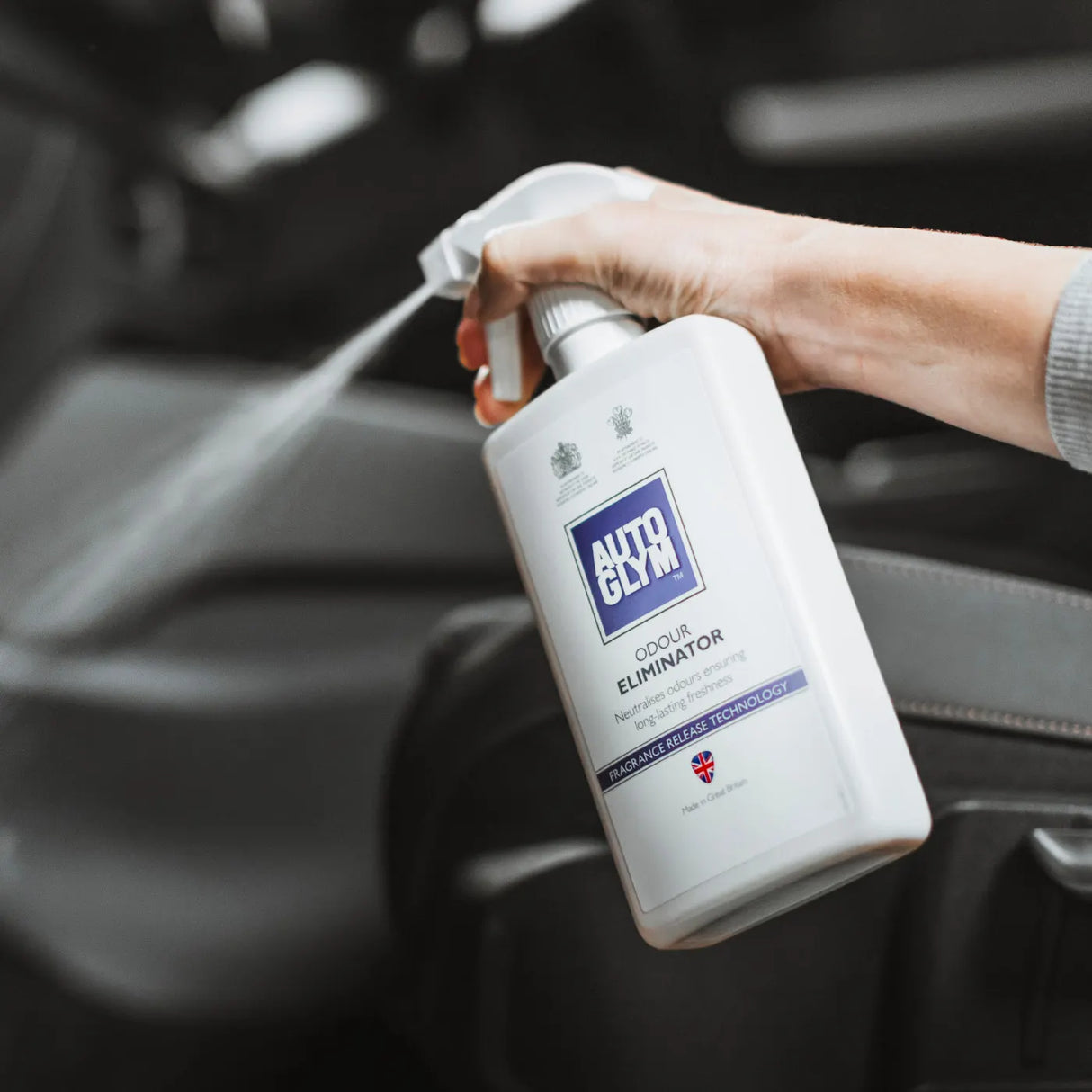 Autoglym Odour Eliminator vehicle cleaner bottle with spray nozzle on a neutral background.