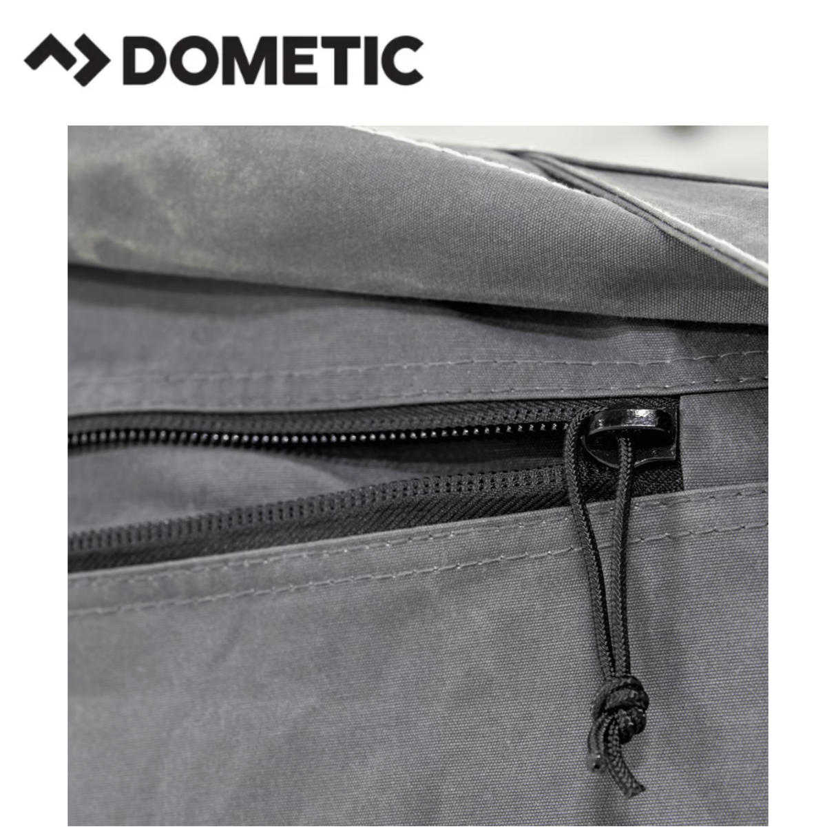 Dometic Rally Air Stay 260s Awning installed on a camper, showcasing its durable fabric and retractable side panels.
