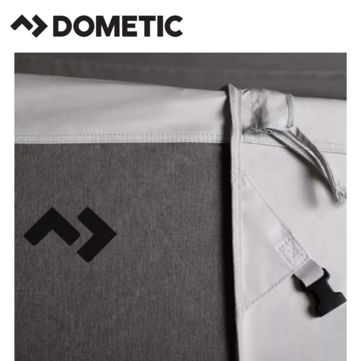 Dometic Stuga Rest Awning extended on a camper, providing shaded outdoor space with durable fabric and sturdy support poles.