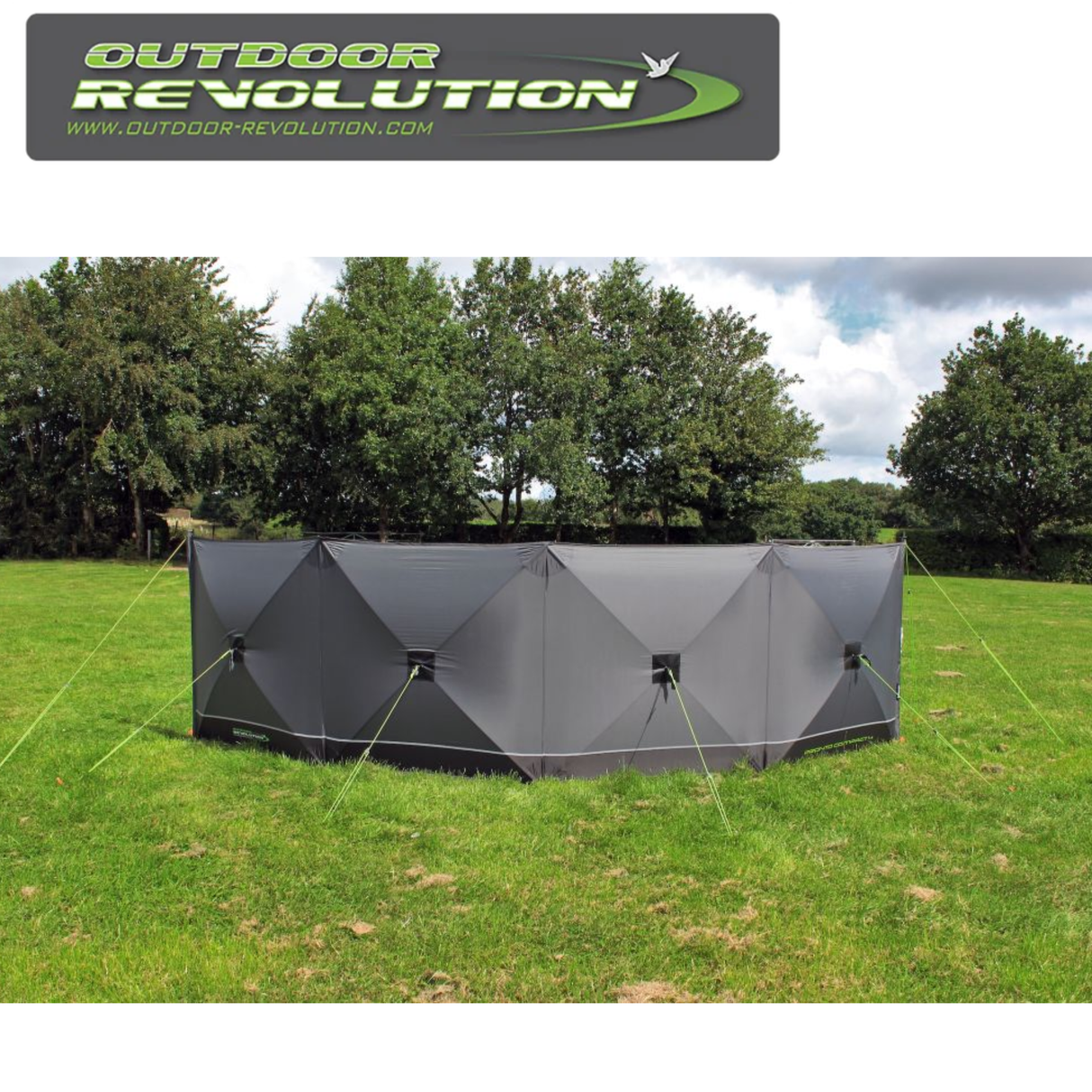Outdoor Revolution Pronto Tensile Active 4 Panel Windbreak set up in a scenic outdoor location, providing wind protection.