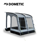 Dometic Rally poled awning set up outdoors, showcasing its sturdy poles and spacious canopy for shade and protection.
