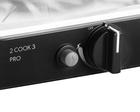 Cadac Dometic 2 Cook 3 Pro Deluxe QR gas BBQ with dual cooking zones and sturdy design, set up outdoors.