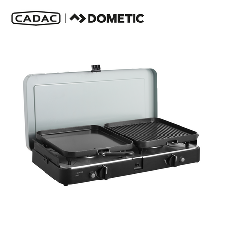 Cadac Dometic 2 Cook 3 Pro Deluxe QR gas BBQ with two cooking surfaces and a sleek design in outdoor setting.