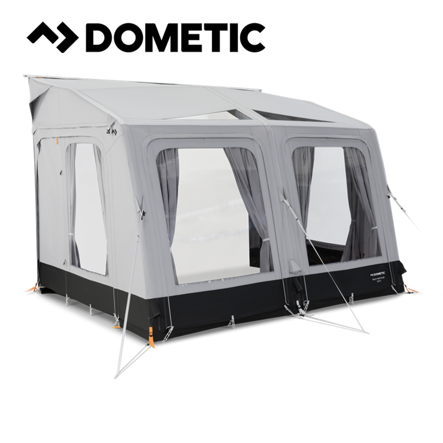 Dometic Rally Air Tour 330 air awning set up outside a camper, showcasing its spacious design and durable construction.