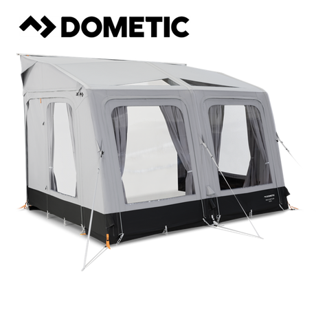 Dometic Rally Air Tour 330 air awning set up outside a camper, showcasing its spacious design and durable construction.