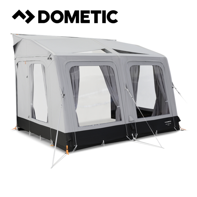 Dometic Rally Air Tour 330 air awning set up outside a camper, showcasing its spacious design and durable construction.