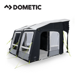 Dometic Rally Air All Season 330 driveaway awning set up next to a camper, showcasing its spacious, weather-resistant design.