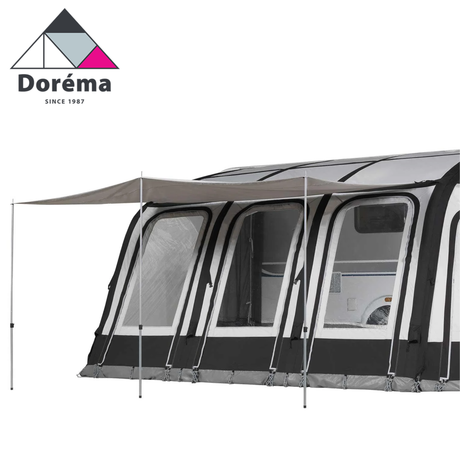 Dorema Magnum AirForce 390 sun canopy set up outdoors, showcasing its spacious design and durable material.