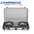 Campingaz Camping Kitchen 2 Maxi stove with BBQ grill, outdoor camping kitchen setup for cooking and grilling.