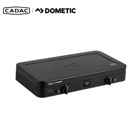 Cadac 2 Cook Turbo FFD Deluxe QR portable gas grill with dual cooking surfaces and sleek design in outdoor setting.