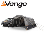 Vango Galli CC Air Low driveaway awning set up beside a campervan, showcasing its spacious design and air pole structure.