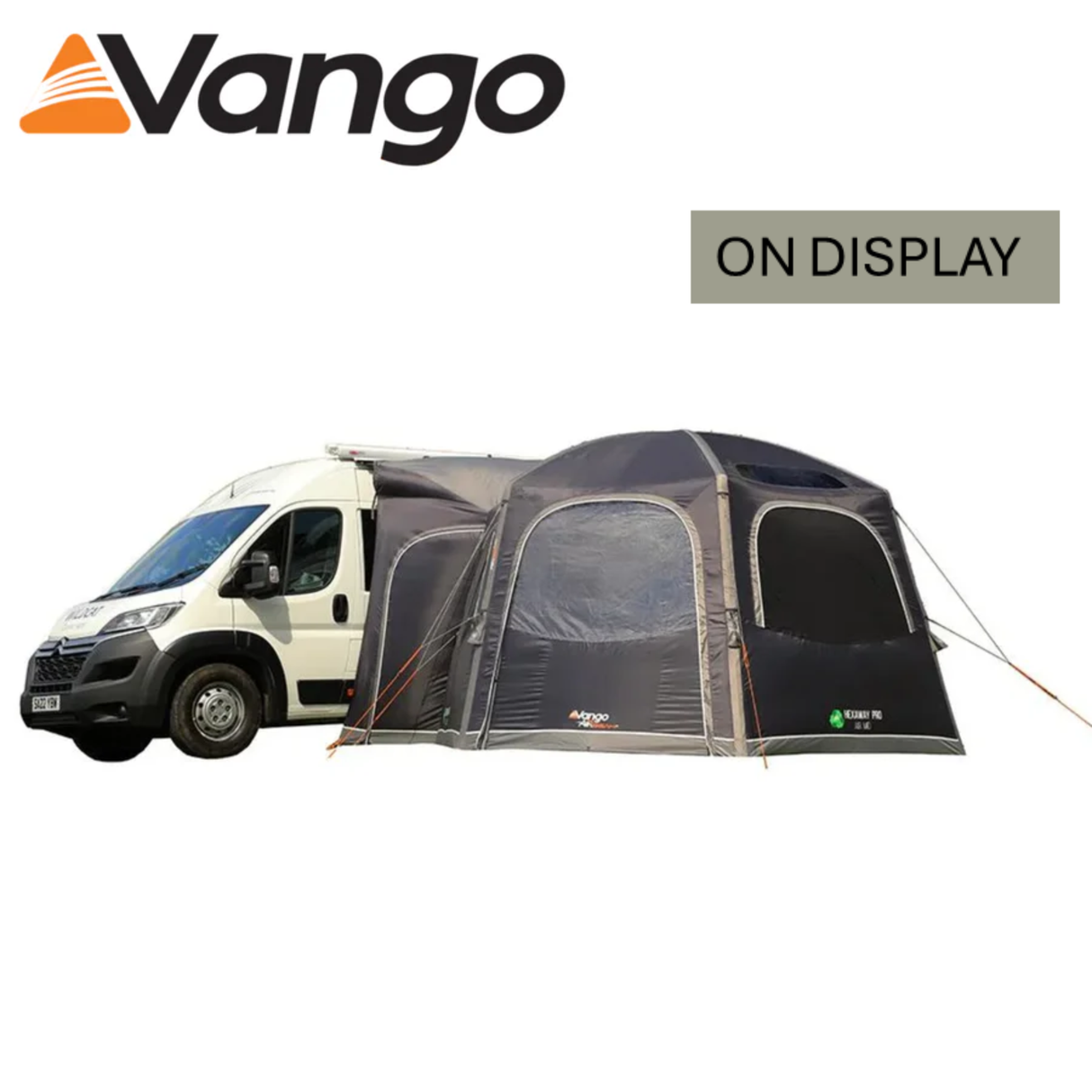 Vango Hexaway Pro Air Mid Driveaway Awning set up beside a camper van, showcasing its spacious and airy interior.