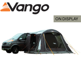 Vango Kela Pro Air Low Driveaway Awning set up beside a campervan, showcasing its spacious design and sturdy structure.