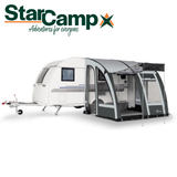 Dorema StarCamp Magnum AirForce Klimatex 260 air porch awning set up outside, showcasing its spacious design and fabric texture.