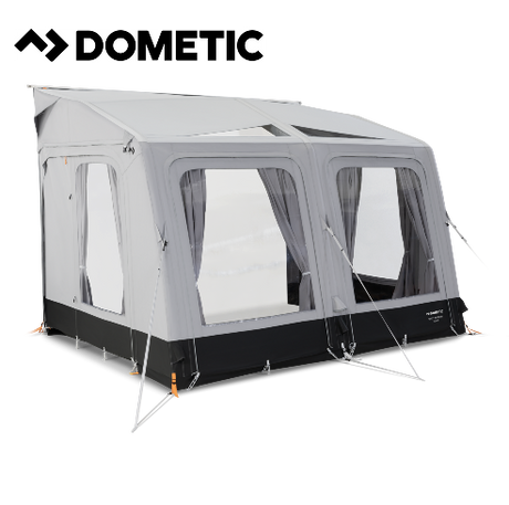 Dometic Rally Air Tour 390 air awning set up outside a caravan, showcasing its spacious design and durable fabric.