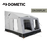 Dometic Rally Air Tour driveaway awning set up beside a campervan, featuring a spacious, airy design and robust fabric.