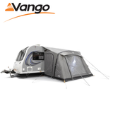 Vango Palma Air 330 Awning in a spacious outdoor setting, showcasing its inflatable design and attached to a caravan.
