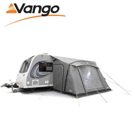 Vango Palma Air 330 Awning in a spacious outdoor setting, showcasing its inflatable design and attached to a caravan.