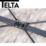 Telta Bornholm large camping table set up outdoors, featuring a sturdy design and ample surface for dining and activities.