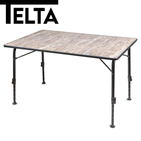 Telta Bornholm medium camping table set up outdoors with a scenic backdrop, showcasing its sturdy design and spacious surface.