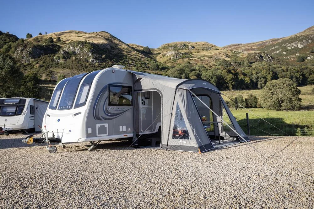 Vango Palma Poled 330 Awning displayed in a campsite setting, showcasing spacious design and sturdy poles.