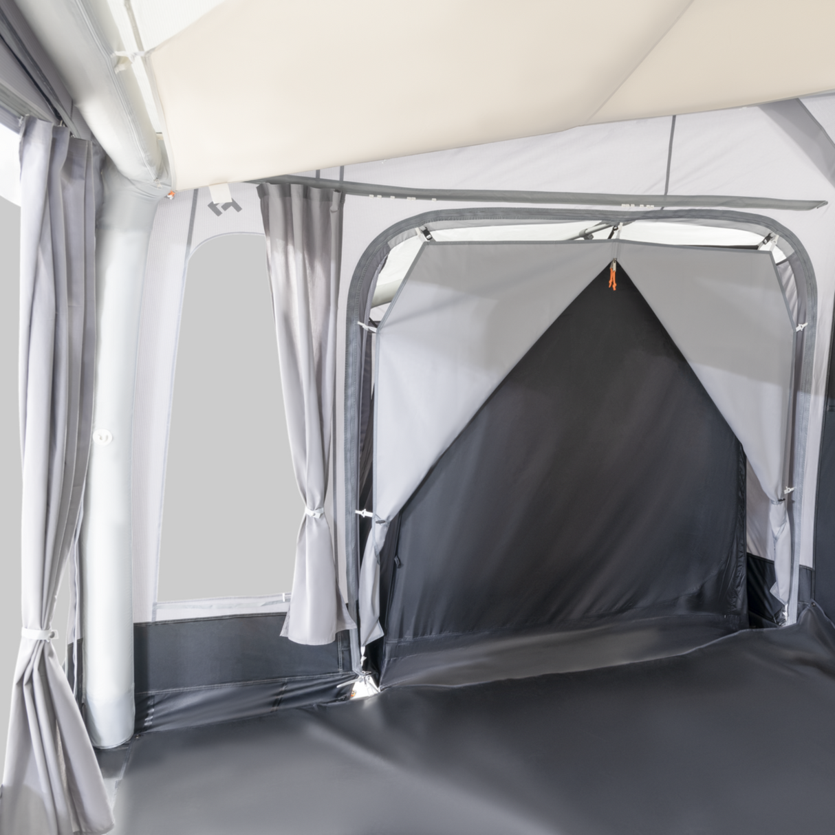 Dometic Residence Tour Air Annexe with inner tent set up in a campsite, showcasing spacious design and durable materials.