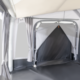 Dometic Residence Tour Air Annexe with inner tent set up in a campsite, showcasing spacious design and durable materials.