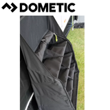 Dometic AccessoryTrack Pro Awning Organiser mounted on an RV, with multiple straps and pockets for storing awning accessories.