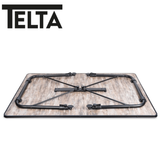 Large Telta Bornholm table with wooden surface and sturdy legs, showcasing its spacious design and natural wood finish.