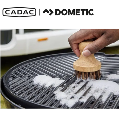 Cadac Dometic GreenGrill Brush with green handle and bristles, designed for cleaning ceramic grill surfaces effectively.