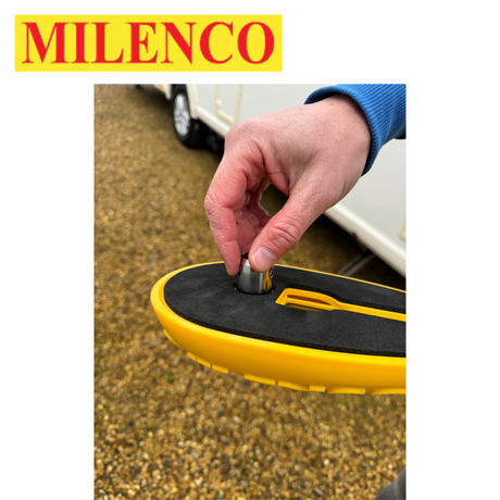 Milenco Wraith 3 Caravan Wheel Lock secured on a caravan wheel, showcasing its robust design and bright color.