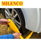 Milenco Wraith 3 Caravan Wheel Lock securely fitted on a caravan wheel, showcasing its robust design and bright color.