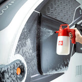 Autoglym Caravan & Motorhome Cleaner bottle with a spray nozzle, set against a clean, outdoor backdrop.
