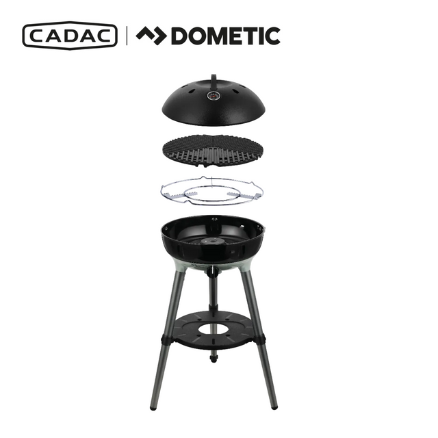 Cadac Dometic Carri Chef 40 gas BBQ with detachable dome, showcasing a portable cooking design in outdoor setting.