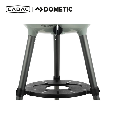 Cadac Dometic Carri Chef 40 gas BBQ with dome, showcasing compact design and cooking surface in outdoor setting.