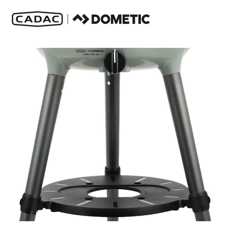 Cadac Dometic Carri Chef 40 BBQ with Chef Pan, portable gas grill in a backyard setting.