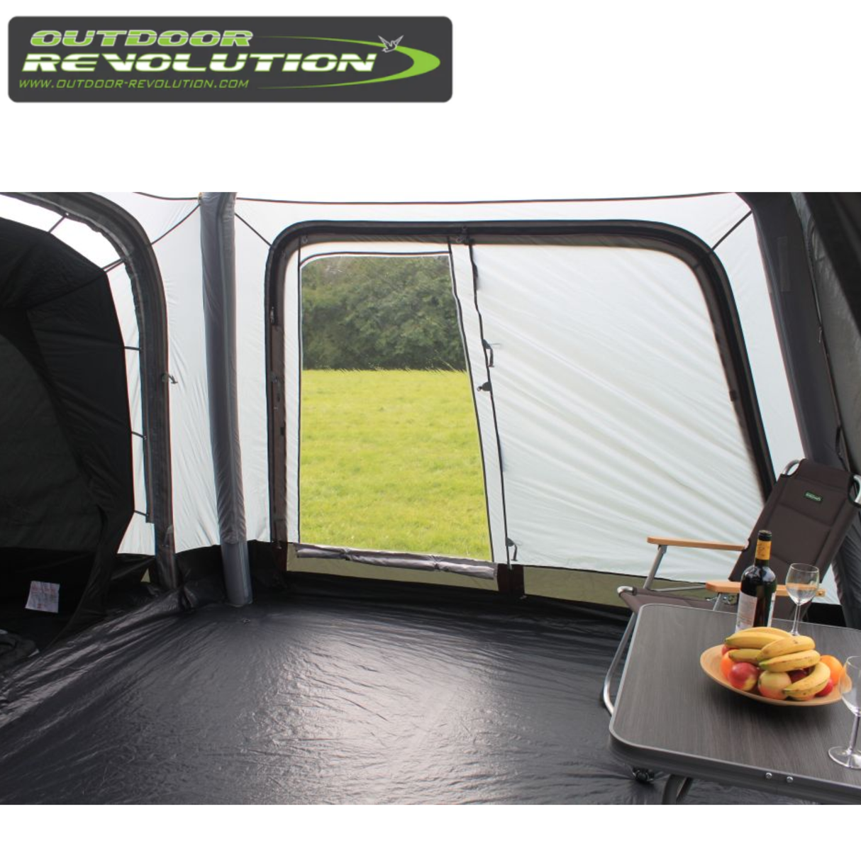 Outdoor Revolution Cayman Air High Driveaway awning set up outside, showing its spacious design and durable fabric for camping.