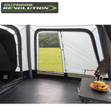Outdoor Revolution Cayman Air High Driveaway awning set up outside, showing its spacious design and durable fabric for camping.