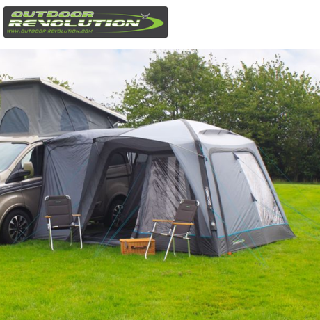 Outdoor Revolution Cayman Air High Driveaway awning set up outdoors, showing its spacious design and durable fabric for camping adventures.