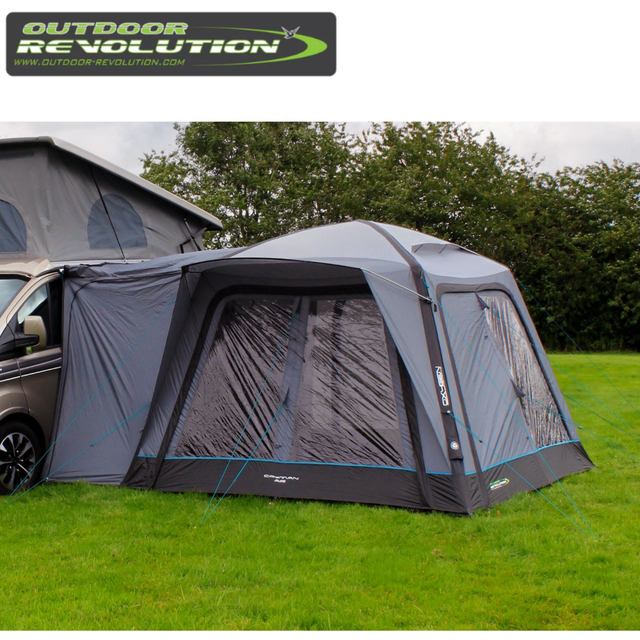 Outdoor Revolution Cayman Air High Driveaway Awning set up on a campsite with spacious fabric and air beam structure for outdoor camping.