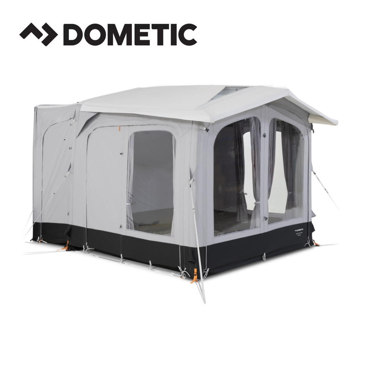Dometic Club Air Tour 260 driveaway awning set up beside a campervan, showcasing its spacious design and durable fabric.