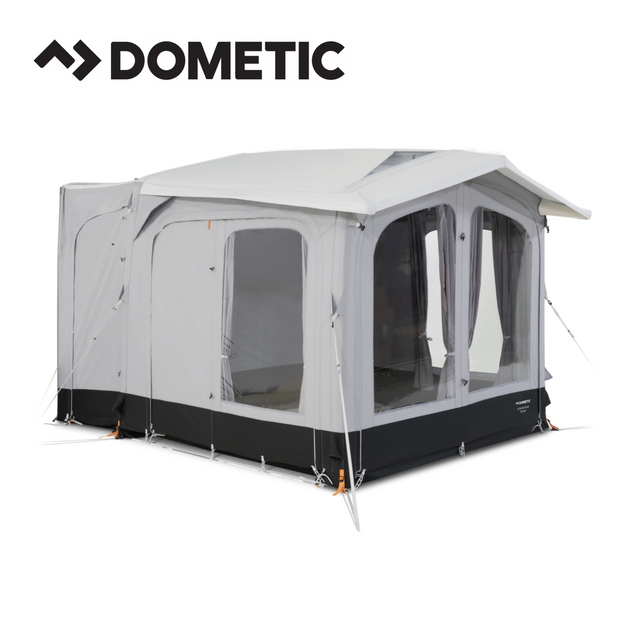 Dometic Club Air Tour 260 driveaway awning set up beside a campervan, showcasing its spacious design and durable fabric.
